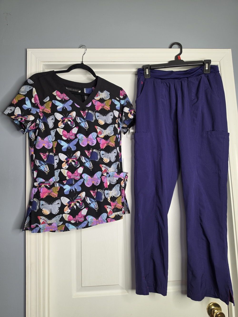 White Cross Black Butterfly Print Scrub Top with Purple Scrub Pants
